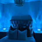 Aarenza Northern Lights bedroom lamp with minimalist design illuminating a cozy bedroom decor scene.