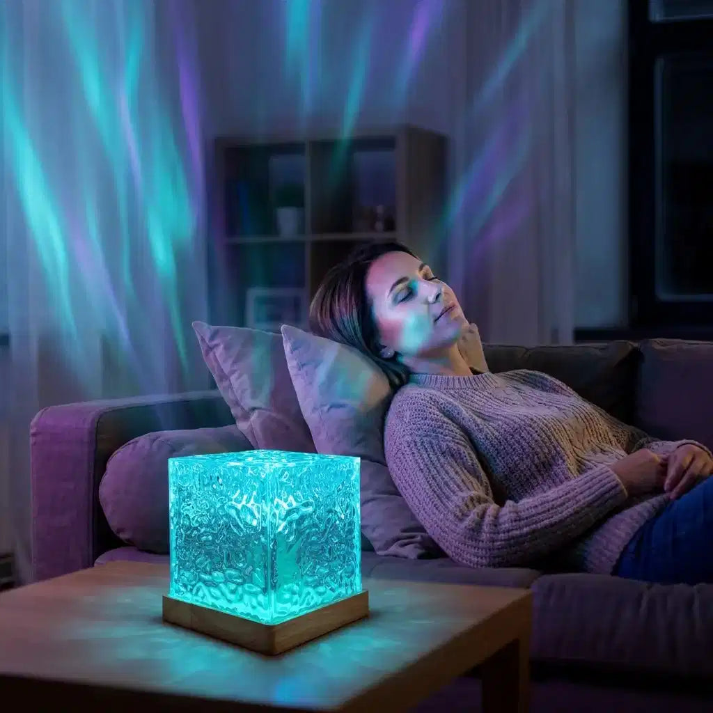 Arenzza Northern Lights bedroom lamp with minimalist design, casting colorful ambient light in a cozy room decor setting.