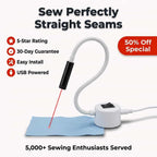 Arenzza Magnetic Sewing Laser projecting precise straight stitch lines onto fabric for accurate sewing.