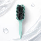 Arenzza Curl Defining Hairbrush with round bristles for detangling and shaping curly hair, shown on a white background.