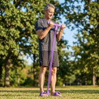 A person using the EasyFit™ Arenzza full-body resistance trainer for a workout in a modern home gym setting.