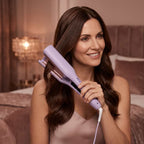 A woman with smooth, salon-quality French curls styled with Arenzza SmoothCurl™ curling iron in a modern lifestyle scene.