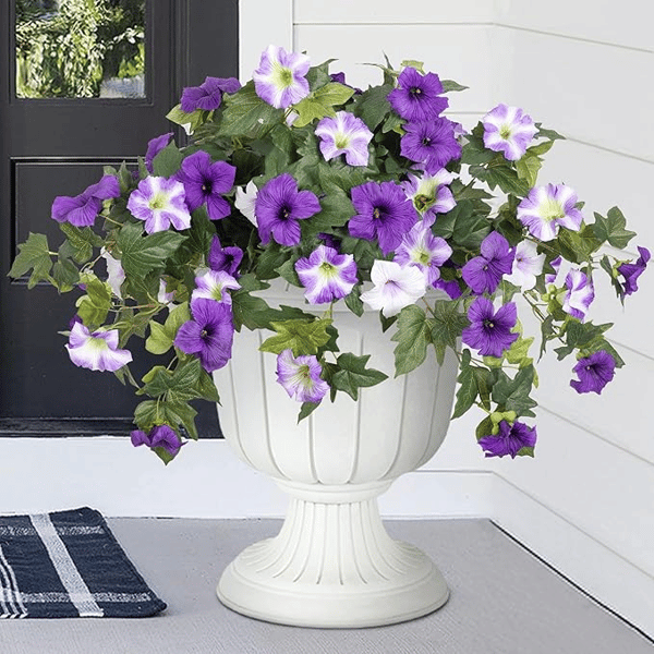 Realistic artificial petunias in vibrant colors, weatherproof floral display by Arenzza for outdoor decoration.