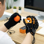Arenzza automatic hand exerciser used for targeted therapy to reduce hand stiffness, shown in a lifestyle scene with a person using the device.