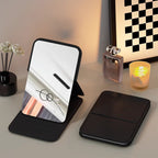 Aarenza Selleasy portable foldable makeup mirror with a sleek compact design, reflecting its reflective mirror surface and foldable frame.