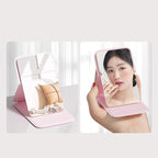 Aarenza Selleasy portable foldable makeup mirror with a sleek compact design, featuring a reflective surface and foldable stand.