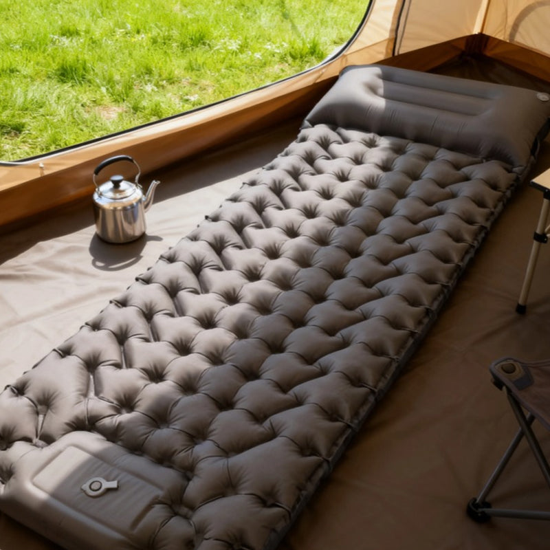 Aarenza lightweight portable air mattress folded and ready for outdoor use, ideal for camping and sports activities.
