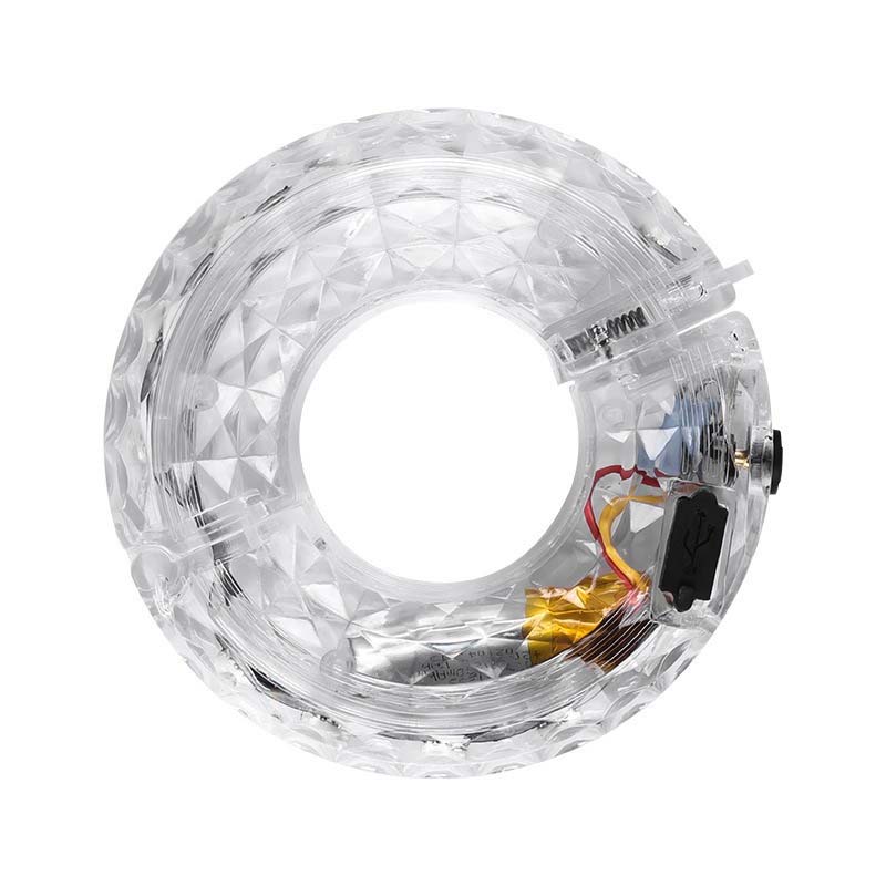 Arenzza LED cycling wheel hub light attached to a bike wheel, illuminating during night riding for visibility and safety.
