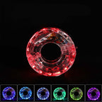 Arenzza LED cycling wheel hub light attached to a bicycle wheel, illuminating during night riding for visibility and safety.