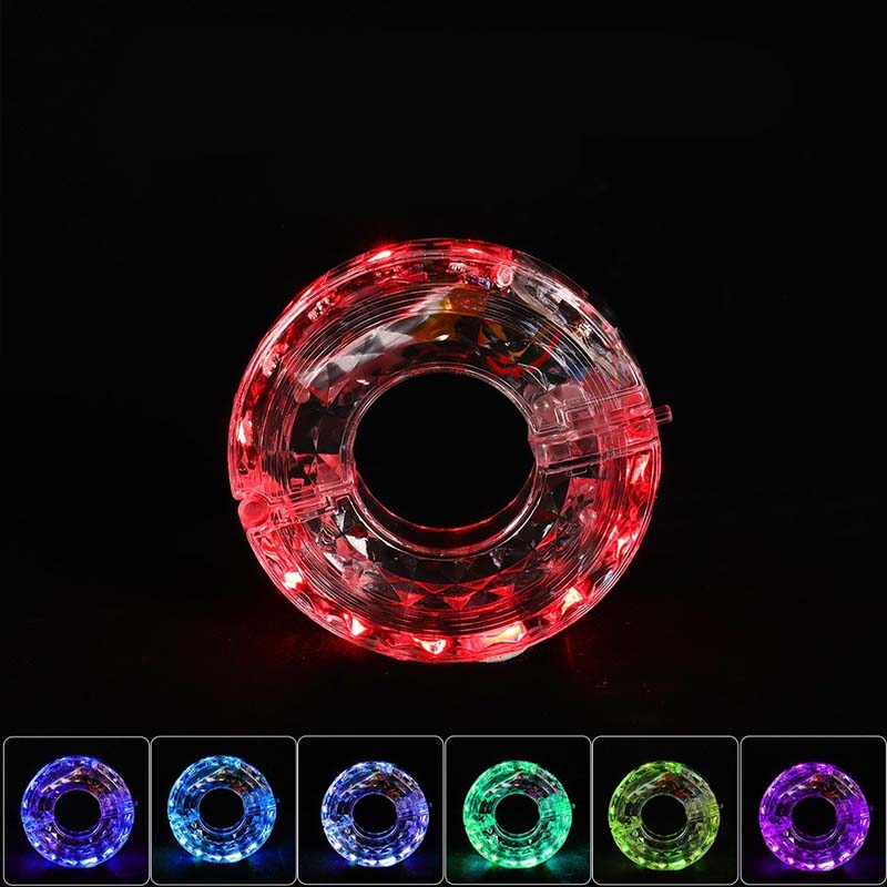 Arenzza LED cycling wheel hub light attached to a bicycle wheel, illuminating during night riding for visibility and safety.