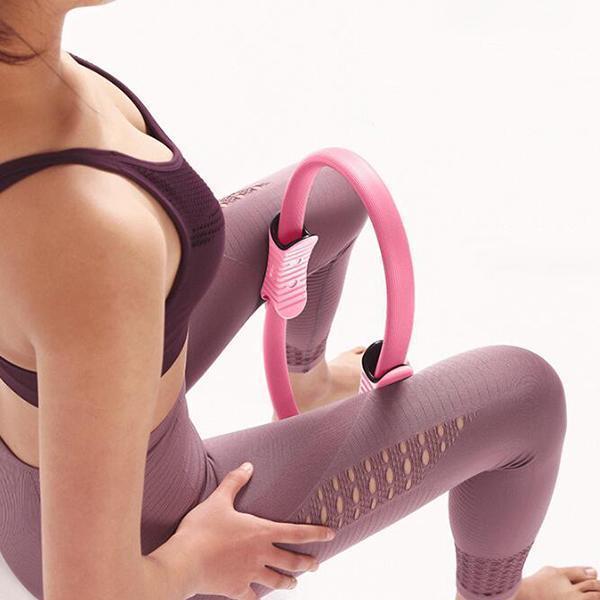 Arenzza Pilates Ring Personal Trainer for fitness, showing a pink exercise ring with handles on a white background.
