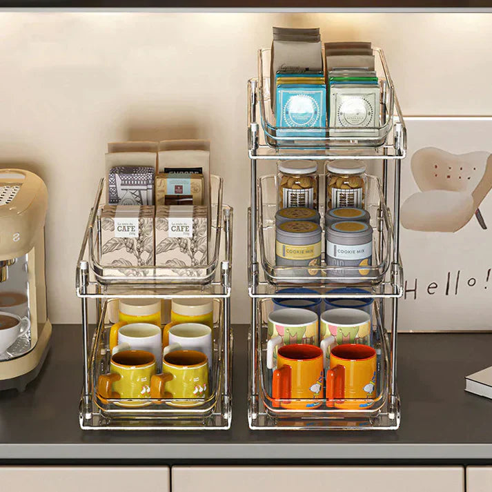 Acrylic pull-out storage organizer with multiple compartments, ideal for practical organization of small items and accessories.