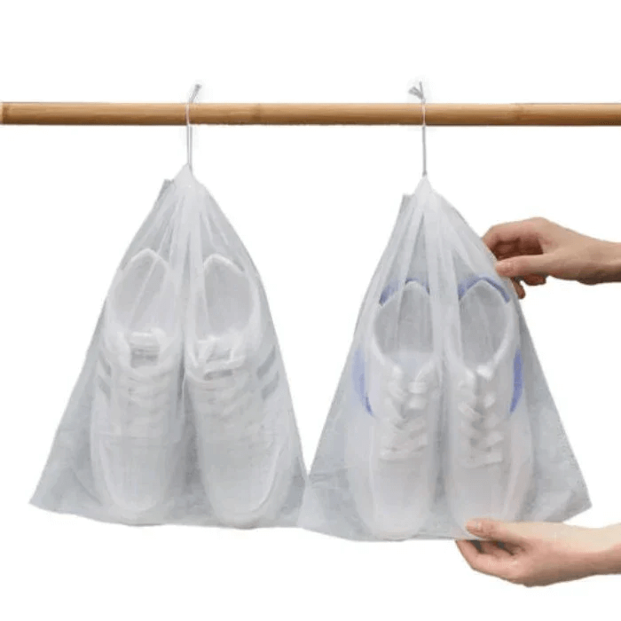 Arenzza reusable drawstring shoe storage bags with black fabric and white drawstrings, designed for organizing shoes.