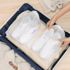 Arenzza reusable drawstring shoe storage bags showing multiple black fabric bags with drawstring closures for organizing shoes.