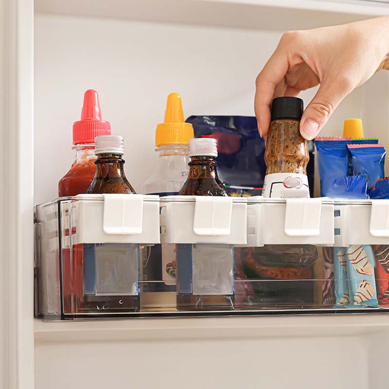 Arenzza adjustable fridge organizer divider showing multiple compartments for flexible food storage and organization in a refrigerator.