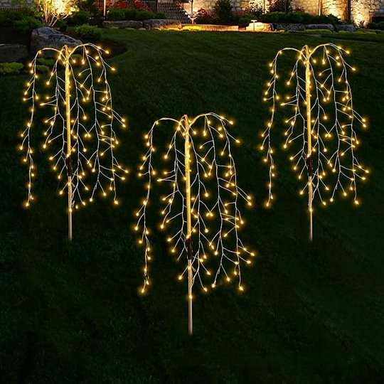 Aarenza LuminaGlow™ Solar Firework Garden Lights in multi-color, waterproof starburst stake lamps illuminating garden paths and patio areas.