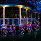 A multi-color LuminaGlow™ Solar Firework Garden Light with starburst design on a stake, waterproof for paths and outdoor patios.