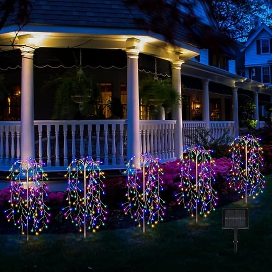 A multi-color LuminaGlow™ Solar Firework Garden Light with starburst design on a stake, waterproof for paths and outdoor patios.