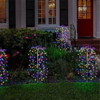 Colorful LuminaGlow™ Solar Firework Garden Lights by Arenzza, waterproof starburst stake lamps illuminating paths and patios.