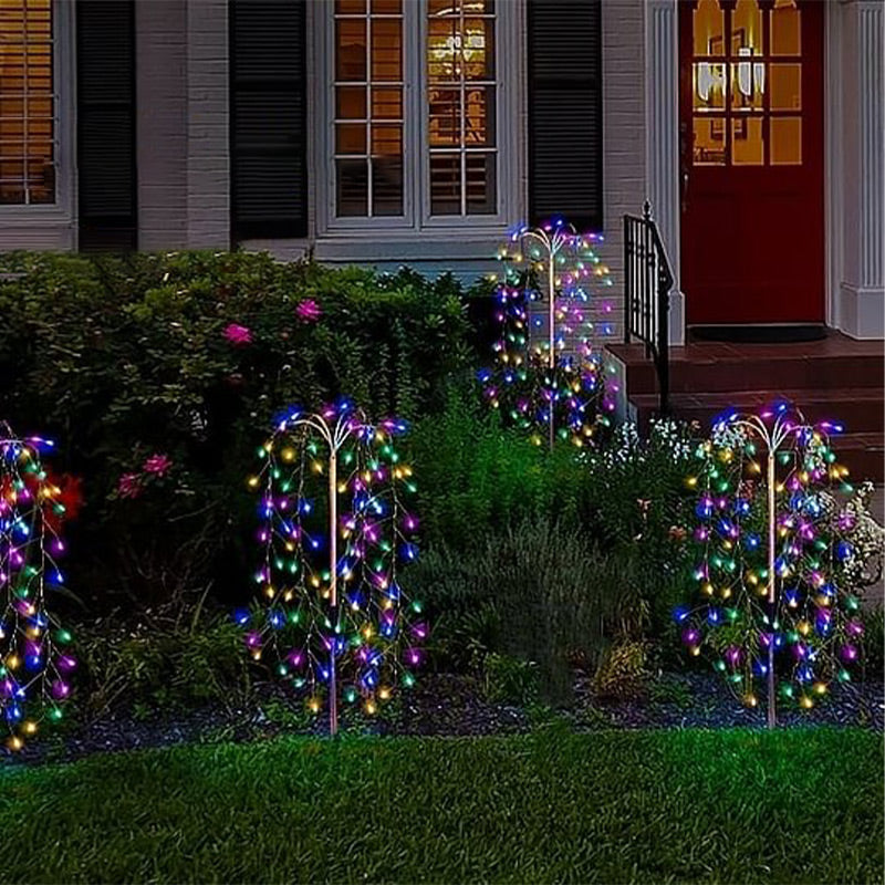 Colorful LuminaGlow™ Solar Firework Garden Lights by Arenzza, waterproof starburst stake lamps illuminating paths and patios.