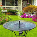 Arenzza solar-powered garden fountain with a decorative water feature, set outdoors with a stone base and lush greenery background.