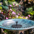 Arenzza solar-powered fountain with water flowing, suitable for garden tools and outdoor decoration, in a garden setting.