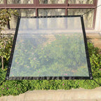 A heavy-duty transparent waterproof insulated tarp by Arenzza, shown with reinforced edges and grommets for outdoor tools and garden use.