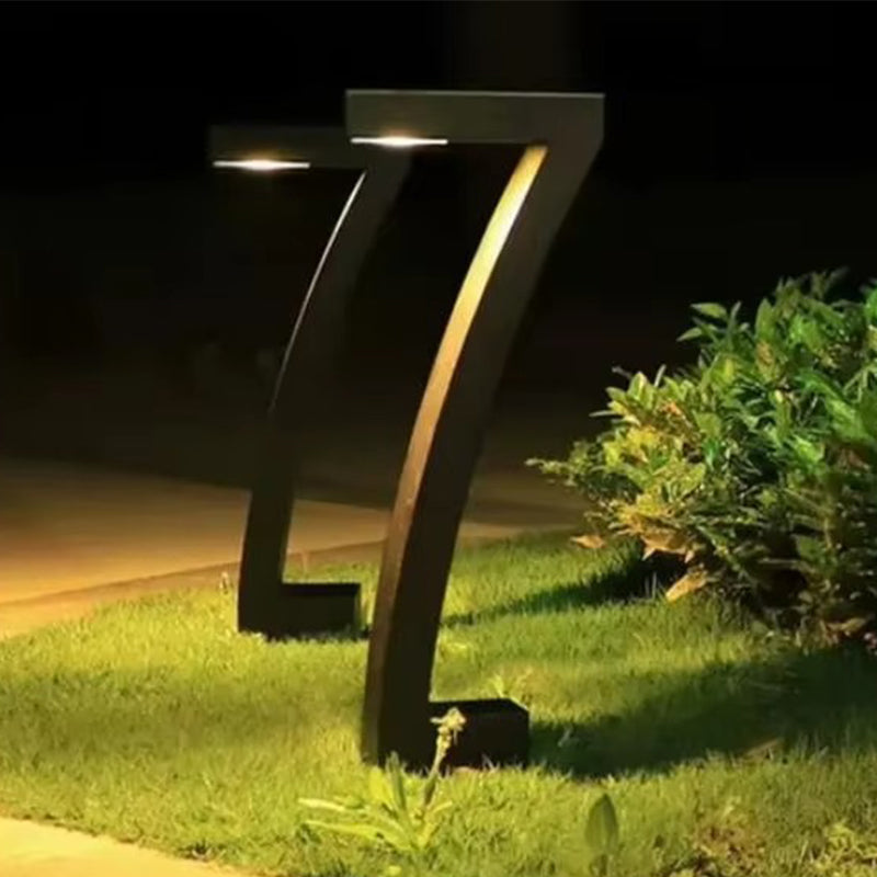 Arenzza waterproof solar pathway lights shining along a garden path, providing outdoor illumination and enhancing garden aesthetics.
