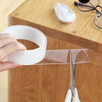 Arenzza clear double-sided tape shown on a roll, ideal for tools and garden projects, with strong, removable adhesive and transparent design.