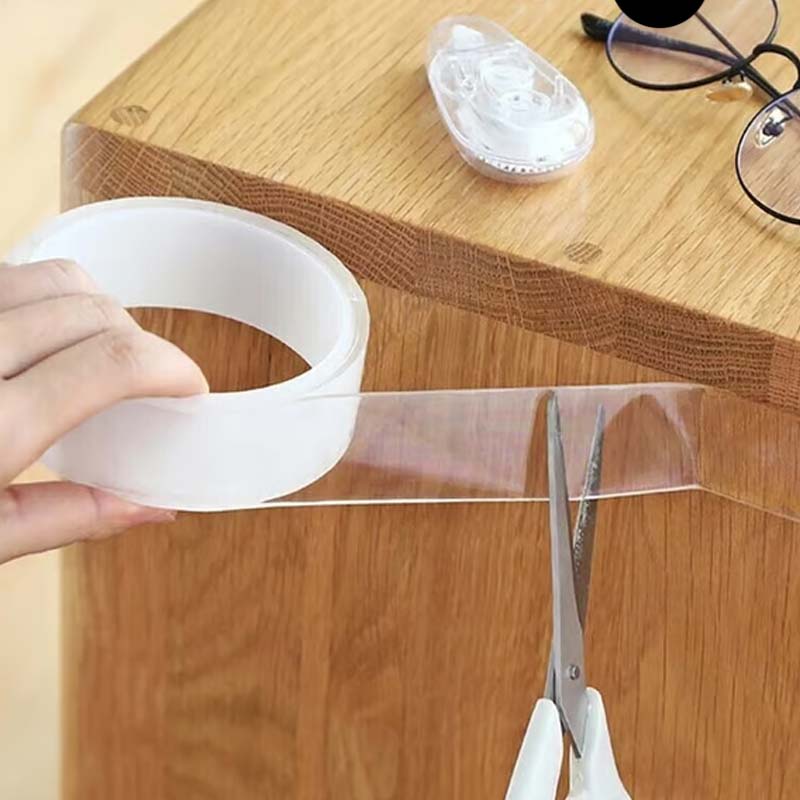 Arenzza clear double-sided tape shown on a roll, ideal for tools and garden projects, with strong, removable adhesive and transparent design.