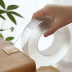 Arenzza removable strong clear double-sided tape shown on a white background, ideal for tools and garden use.