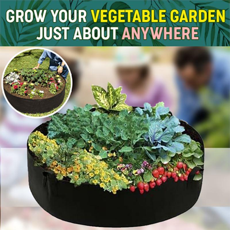 Aarenza fabric round raised garden bed planter pot with herbs, flowers, vegetables, and potatoes in a garden setting.