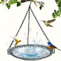 Arenzza Solar Cascade Hanging Bird Bath Fountain with cascading water, garden tools and birdbath in a garden setting.