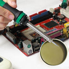 Arenzza soldering flux paste in a small container, used for precision electronic soldering and maintenance.