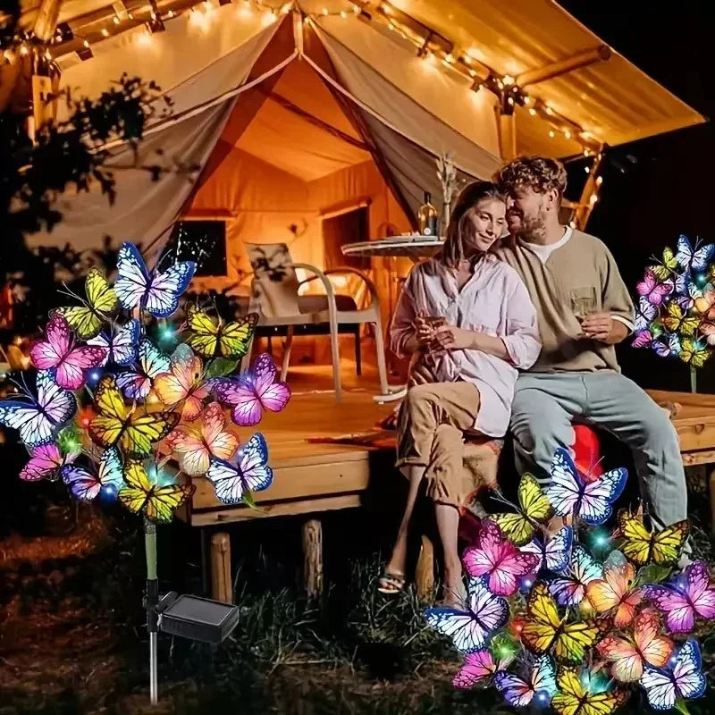Arenzza solar outdoor butterfly garden lights glowing in a garden setting, decorative tools and garden lighting for outdoor decor.