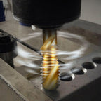 A set of six Arenzza multipurpose spiral tap tools for metalworking, arranged on a workbench with various tools in the background.