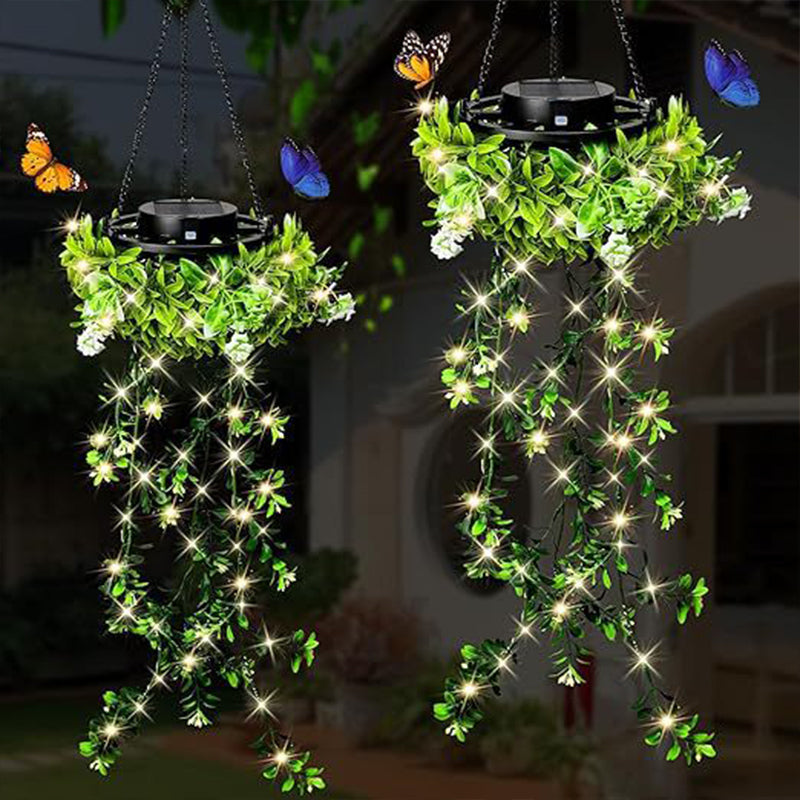 A Arenzza Solar Hanging Grass Light with realistic foliage, warm white glow, weatherproof IP65, suitable for garden decor and outdoor lighting.