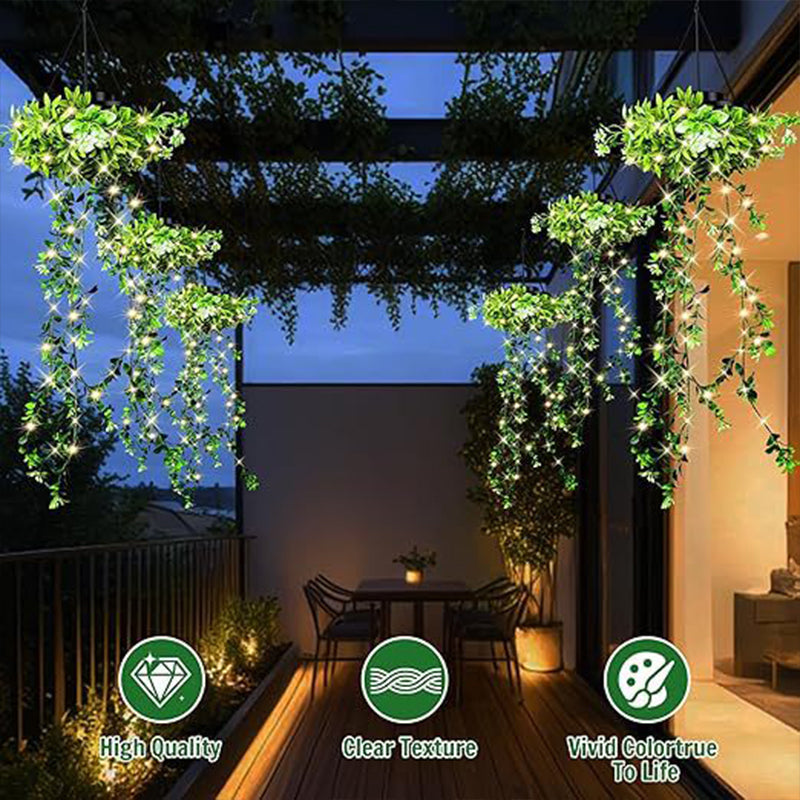 A Arenzza solar hanging grass light with realistic foliage and warm white glow, designed for outdoor garden lighting, IP65 waterproof.