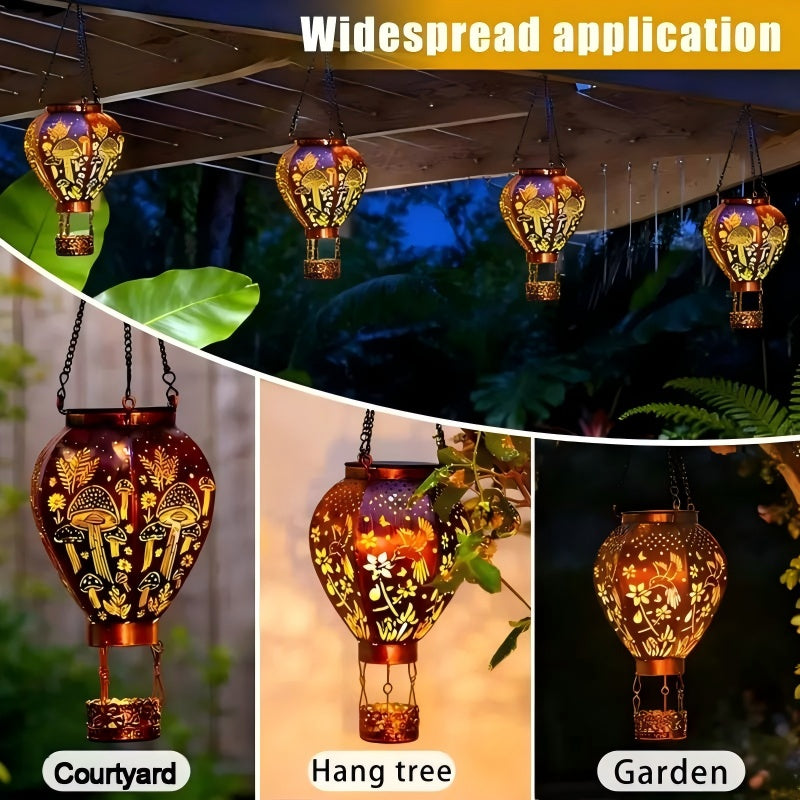 Solar-powered hot air balloon lantern from Arenzza, hanging outdoors with a colorful fabric envelope and a sturdy metal basket.