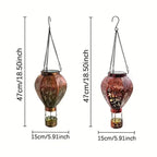 Solar-powered hot air balloon lantern by Arenzza with a colorful fabric cover and solar panel, suitable for garden decoration and lighting.