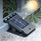 Arenzza outdoor solar clip light with motion sensor, mounted on garden wall, illuminating the area at night.