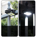 Arenzza outdoor solar clip light with motion sensor installed on a garden wall, illuminating the area at night
