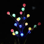 Arenzza solar-powered LED garden stake light shaped like a tree branch, ideal for outdoor garden and landscape illumination.