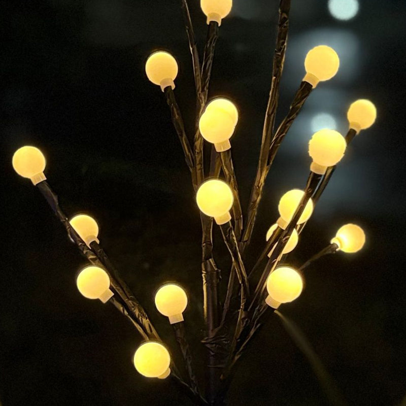 Arenzza solar powered LED garden stake light shaped like a tree branch, ideal for outdoor garden and yard illumination.