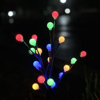 Arenzza solar-powered LED garden stake light shaped like a tree branch, ideal for outdoor garden and landscape lighting.