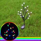 Arenzza solar-powered LED garden stake light with tree branch design illuminating outdoor garden space at night