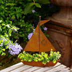 Rustic metal sailboat planter by Arenzza, weather-resistant garden decor for succulents, herbs, or flowers on shelves or in gardens.