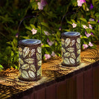 Aarenza hanging solar shadow lantern with hollow design, outdoor garden tool with intricate cutout patterns for decorative lighting.