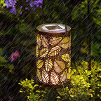 A hanging solar shadow lantern with hollow design, decorative outdoor garden tool by Arenzza, illuminated with intricate patterns.