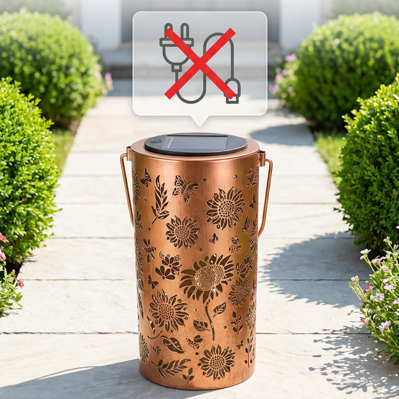 A hanging solar shadow lantern with hollow design by Arenzza, showcasing intricate cut-out patterns for garden decoration.